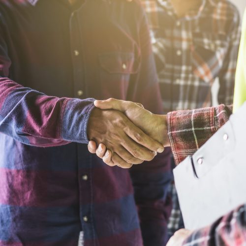 Construction,Worker,And,Contractor.,Client,Shaking,Hands,With,Team,Builder